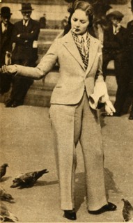 'A betrousered lady feeding pigeons in Trafalgar Square', 1933. Creator: Unknown.