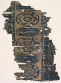 Brocaded silk fragment with running animal roundels and kufic inscriptions, 1530-1950. Creator: Unknown.