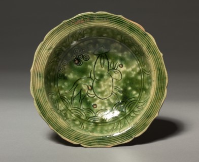 Dish with Incised Design of a Rider on a Mule: Oribe Ware, c. 1600. Creator: Unknown.