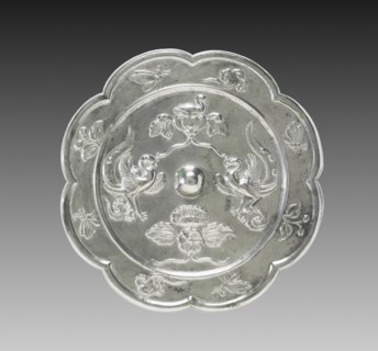 Lobed Mirror with Paired Phoenixes, a Nestling Bird, and a Lotus Blossom, 700s. Creator: Unknown.