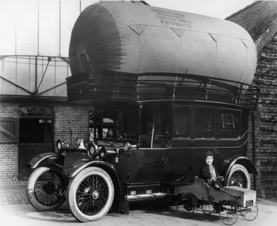 1913 Lanchester with gas bag conversion and boy in pedal car. Creator: Unknown.