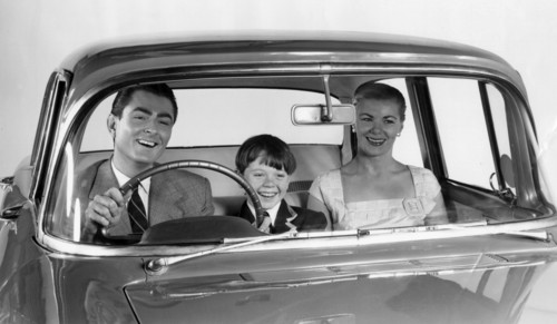 1957 Vauxhall Victor with family together in front seat. Creator: Unknown.