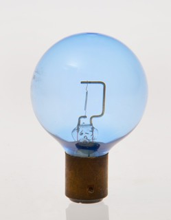 Blue headlamp bulb circa 1930. Creator: Unknown.