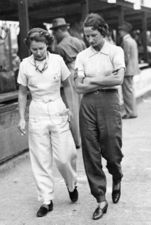 Elsie Wisdom (right) with Kaye Petre in pits at Brooklands. Creator: Unknown.