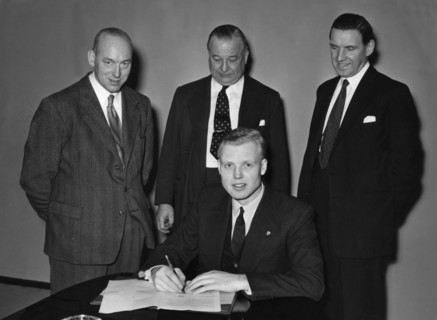 Mike Hawthorn signing Vanwall contract 1955. Creator: Unknown.