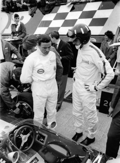 Jim Clark and Graham Hill in pits with Lotus 49 during 1967 British Grand Prix. Creator: Unknown.