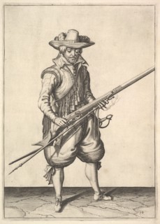 A soldier shaking the powder from the top of the pan, from the Musketeers series, plate 19, in.... Creator: Unknown.