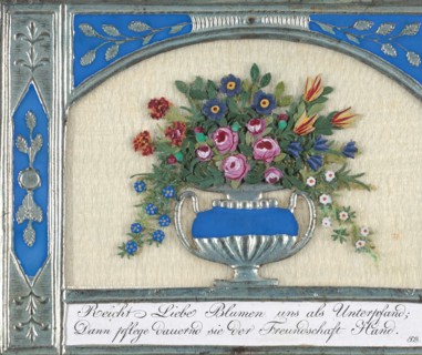 Greeting Card: silver embossed paper frame, engraved motto on white card stock, silk chiffon, silver 'Dresden' urn scrap, tiny floral embellishments made of a clay-like material, watercolor, and graph...