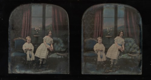 [Stereograph, Two Children Standing Between Furniture in a Studio Parlor Setting], ca. 1855.