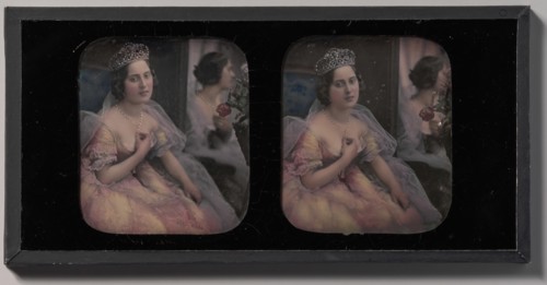 [Stereograph of a Woman Wearing a Tiara and Tulle and Lace Dress, Seated Before a Mirror], 1850s.