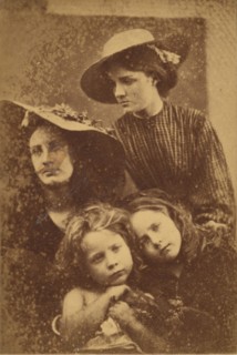 Summer Days, 1866-69. Two young women (May Prinsep and Mary Ryan) wearing straw hats, two young children (Freddy Gould and Elizabeth Keown) are seated in front.