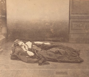 [La Comtesse Reclining in Dark Dress with Chain Around Neck], 1861-65.