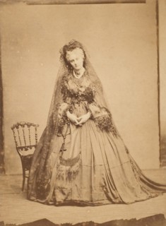 [Standing with a Rosary], 1861-67.
