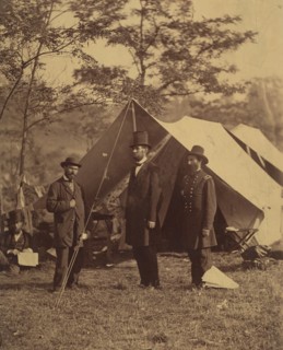 [President Abraham Lincoln, Major General John A. McClernand (right), and E. J. Allen (Allan Pinkerton, left), Chief of the Secret Service of the United States, at Secret Service Department, Headquart...