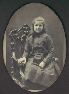 [Girl with Ringlets, Seated, Three-Quarter Length], 1890s.