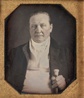 Elderly Man Holding Ivory-topped Walking Stick, 1840s.