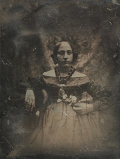 Young woman holding a flower, ca. 1842.