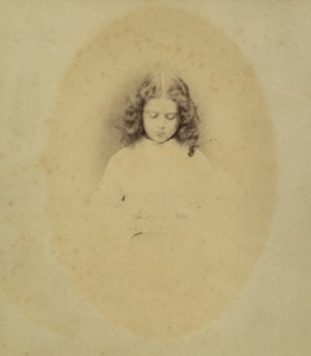 Edith Liddell Seated Beside a Vase of Foxgloves, 1860.