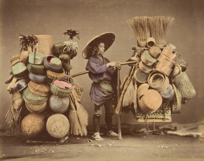 [Japanese Man Posing with Baskets, Brooms and Feather Dusters], 1870s.