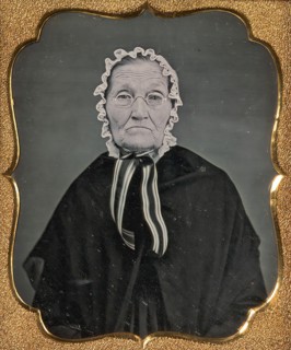 Elderly Woman Wearing Glasses and a Soft Bonnet, 1850s.