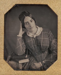 Young Woman with Elbow Resting on Small Pile of Books and Head on Hand, 1840s.
