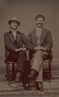 Two Seated Young Men Holding Hands, 1880s.