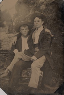Two Young Men in Straw Hats, One Seated in the Other's Lap, 1870s-80s.