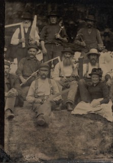 A Woman and Eight Carpenters Posed Outdoors, 1880s.