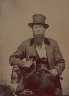 Man in Top Hat Holding a Hammer and Wrench, 1860s- early 70s.