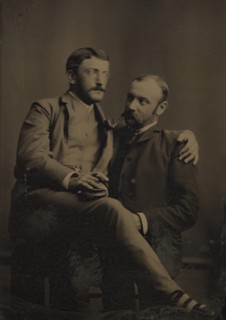 Two Men Smoking, One Seated in the Other's Lap, 1880s-90s.
