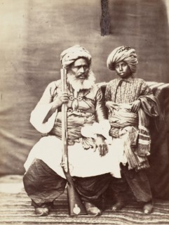 Turbaned Man Holding Rifle with Boy Alongside, 1860s.