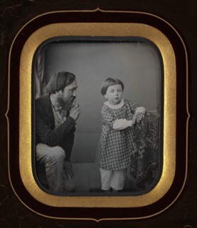 [Man Calming a Young Boy Posing before the Camera], ca. 1850.