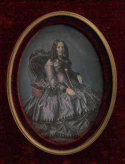 Finely Dressed Woman Seated in Armchair, 1850s.