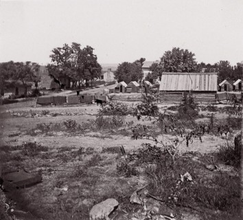 [View of a small town with wooden sheds in distance]. Brady album, p. 123, 1861-65. Formerly attributed to Mathew B. Brady.