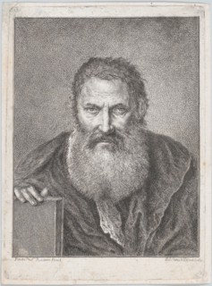 Portrait of a bearded man holding a book