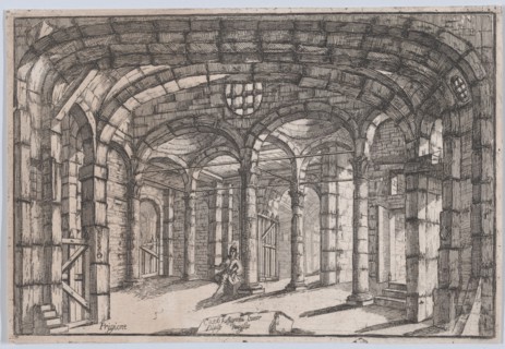 Interior of a prison in which sits a woman