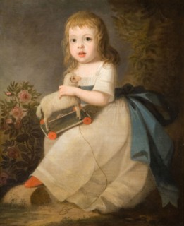 Portrait of a Child with a Toy Sheep