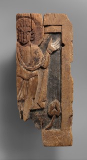 Fragmentary Carved Panel with a Saint