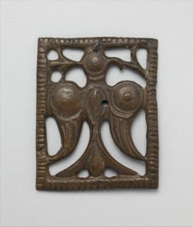 Appliqué Plaque with a Standing Eagle, Iran, 12th century. Perhaps ornamenting leather horse trappings or a belt.