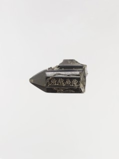 Cylindrical Pendant with Magical Writing, Iran, 9th-10th century. The inscription remains undeciphered and may be a magical alphabet.