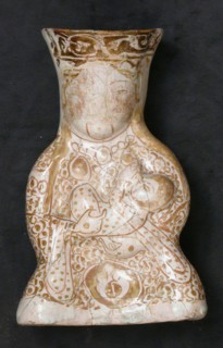 Hollow Vessel in the Shape of a Woman Holding a Child, Iran, 12th-13th century.