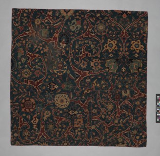 Blue-ground Carpet Fragment with Scrolling Floral Vines, Iran, 17th century.
