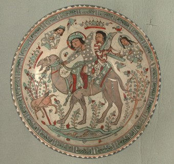Bowl, Iran, 12th-13th century. Bahram Gur, riding a camel with one of his slaves, Azadeh playing a harp.