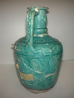 Ewer with Molded Inscriptions, Animals and Dancers, Iran, last quarter 11th or 12th century. Inscription mentions the name of the potter, Abu Ahmad Qassa?i. Choral dances performed at the time include...