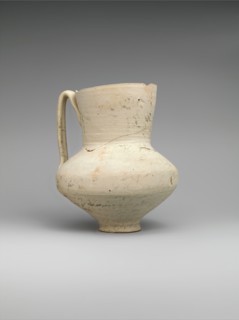 Unglazed Jug with Writing, Iran, 8th-9th century. Entire surface covered with writing, with faint image of a demon possibly an incantation vessel.