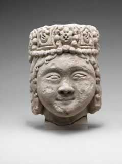 Head from a Figure with a Beaded Headdress, Iran, 12th-early 13th century. rare example from the Seljuq period.
