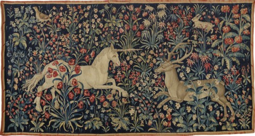 A unicorn and a stag in a field of flowers , c. 1500. Private Collection.