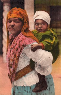 Mother and child, Tangier, 1932. Moroccan woman carrying her baby.