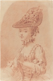 A Young Girl Wearing a Flowered Hat.