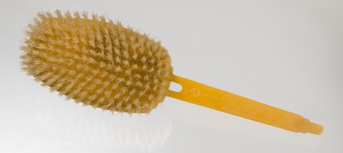 Bakelite hair brush from dresser set owned by Lena Horne, mid 20th Century. Creator: Agalin.